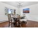 Dining room featuring a bay window for ample natural light and a rustic wooden dining set at 8170 Lt William Clark Rd, Parker, CO 80134