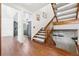 Hallway with hardwood flooring leading to an open floor plan with a view of the kitchen at 8170 Lt William Clark Rd, Parker, CO 80134