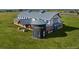 Stunning barn home featuring a unique silo element, and surrounded by sprawling green grass at 2071 Generations Aly, Brighton, CO 80601