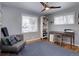 Well-lit office with a chair, desk, and a large rug at 3133 S Gaylord St, Englewood, CO 80113