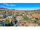 Breathtaking aerial view of the beautiful neighborhood nestled among mature trees and rolling hills at 9 Mule Deer Trl, Littleton, CO 80127