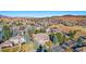Stunning aerial view of the home surrounded by lush trees, manicured lawns, and mountain scenery at 9 Mule Deer Trl, Littleton, CO 80127