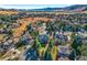 Expansive aerial view of the community featuring well-manicured lawns and stunning mountain views at 9 Mule Deer Trl, Littleton, CO 80127