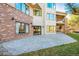 Exterior view of the home showing a paved patio area leading to the grassy backyard at 9 Mule Deer Trl, Littleton, CO 80127