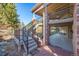 Spacious backyard deck with elegant stairs and a stone patio for outdoor living at 9 Mule Deer Trl, Littleton, CO 80127