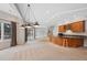 Finished basement includes a granite countertop wet bar with seating and sliding glass door at 9 Mule Deer Trl, Littleton, CO 80127