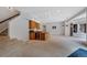 Finished basement boasts a wet bar, recessed lighting, and an open floor plan perfect for entertaining at 9 Mule Deer Trl, Littleton, CO 80127