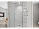 Modern bathroom with a glass-enclosed shower, soaking tub, and stylish tile work at 9 Mule Deer Trl, Littleton, CO 80127