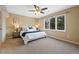 Warm and inviting bedroom with a large window and ample natural light at 9 Mule Deer Trl, Littleton, CO 80127