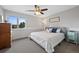 Comfortable bedroom with a queen-size bed, natural light, and cozy decor at 9 Mule Deer Trl, Littleton, CO 80127