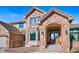 Inviting brick home entrance with archway and a charming front door at 9 Mule Deer Trl, Littleton, CO 80127