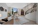 Bright, spacious living room with large windows and neutral decor at 9 Mule Deer Trl, Littleton, CO 80127