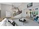 Spacious living room with staircase and view to dining area at 9 Mule Deer Trl, Littleton, CO 80127