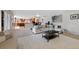 Open-concept living room with an eat-in kitchen, connected to a formal sitting area at 9 Mule Deer Trl, Littleton, CO 80127