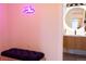 Stylish bathroom with a modern vanity, lighted round mirror, and fun 'good vibes' neon sign at 3701 S Grant St, Englewood, CO 80113