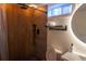 Well-lit bathroom featuring a modern vanity with an illuminated mirror and a tiled shower at 3701 S Grant St, Englewood, CO 80113