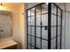 Modern bathroom features a stylish glass shower enclosure with black trim and subway tile at 3701 S Grant St, Englewood, CO 80113
