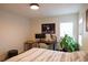 Bright bedroom featuring a desk and work area near a window and a comfortable bed at 3701 S Grant St, Englewood, CO 80113