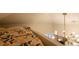 This cozy bedroom loft features a modern light fixture at 3701 S Grant St, Englewood, CO 80113
