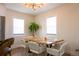 Dining room with wooden table, modern chairs, and a chandelier at 3701 S Grant St, Englewood, CO 80113