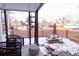 Inviting front porch with seating area, perfect for enjoying the neighborhood views at 3701 S Grant St, Englewood, CO 80113