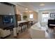 Spacious living room with an open concept layout, stainless appliances, and modern furnishings at 3701 S Grant St, Englewood, CO 80113