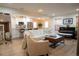 Bright, open living area with modern furniture flowing into the kitchen and dining areas at 3701 S Grant St, Englewood, CO 80113