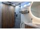 Modern bathroom with updated tilework, a rainfall showerhead, and neutral decor at 3701 S Grant St, Englewood, CO 80113