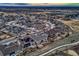 Aerial view of the residential area with winding streets and well-maintained homes at 9521 Garnett Way, Arvada, CO 80007