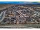 Aerial view of the neighborhood showcasing the home, nearby streets, and surrounding landscape at 9521 Garnett Way, Arvada, CO 80007