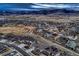 Scenic aerial shot of the neighborhood with vast mountain views and nearby trails at 9521 Garnett Way, Arvada, CO 80007