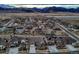 Scenic aerial view of the neighborhood featuring mountain views and nearby open spaces at 9521 Garnett Way, Arvada, CO 80007