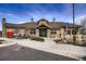 Charming clubhouse exterior featuring stone accents, covered entrance, and accessible parking at 9521 Garnett Way, Arvada, CO 80007