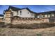 Candela's community entrance sign in a stone surround at 9521 Garnett Way, Arvada, CO 80007