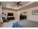 Spacious bedroom featuring tray ceilings and classic dark wood furniture set at 9521 Garnett Way, Arvada, CO 80007