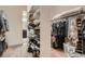 Walk-in closet with built-in shelving for optimal organization and storage at 9521 Garnett Way, Arvada, CO 80007