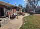 Relaxing patio with outdoor seating, a swing, built-in grill, and backyard access at 1004 W Shepperd Ave, Littleton, CO 80120