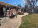 An inviting outdoor patio seating area provides a relaxing space in the backyard of this brick home at 1004 W Shepperd Ave, Littleton, CO 80120