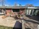 Backyard with brick and concrete patio featuring outdoor seating, perfect for entertaining near the main house at 1004 W Shepperd Ave, Littleton, CO 80120