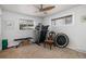 Bright room with natural light and ceiling fan, exercise equipment including treadmill and weights at 1004 W Shepperd Ave, Littleton, CO 80120