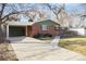 Charming single-story brick home with a well-maintained front yard and a covered parking area at 1004 W Shepperd Ave, Littleton, CO 80120