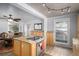 Modern kitchen with granite countertops, stainless steel appliances, and open layout leading to the dining area at 1004 W Shepperd Ave, Littleton, CO 80120