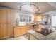 Bright kitchen featuring stainless steel appliances, granite countertops, and stylish cabinetry at 1004 W Shepperd Ave, Littleton, CO 80120