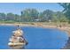 Scenic lake with statue in a serene and tranquil setting at 1004 W Shepperd Ave, Littleton, CO 80120