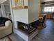 Modern living room featuring a fireplace and hardwood floors that opens to the adjacent kitchen area at 1004 W Shepperd Ave, Littleton, CO 80120