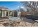 Cozy backyard patio with outdoor dining set, hot tub, privacy fence and outdoor storage shed at 1004 W Shepperd Ave, Littleton, CO 80120