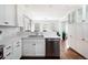 Modern kitchen with white cabinets, stainless steel appliances, and large island at 350 Cherry St, Denver, CO 80220