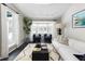 Spacious living room with bay window, comfy seating, and a modern coffee table at 350 Cherry St, Denver, CO 80220