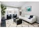 Spacious living room with bay window, comfy seating, and a modern coffee table at 350 Cherry St, Denver, CO 80220