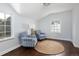 Relaxing sitting area with two comfy armchairs and a jute rug at 350 Cherry St, Denver, CO 80220